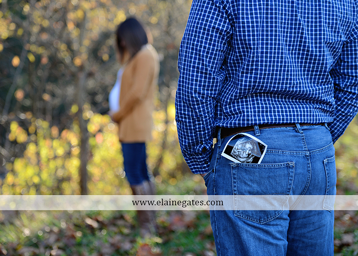 Mechanicsburg Central PA portrait photographer maternity outdoor path trees grass water stream creek kiss holding hands pillow sonogram belly rings jm 4