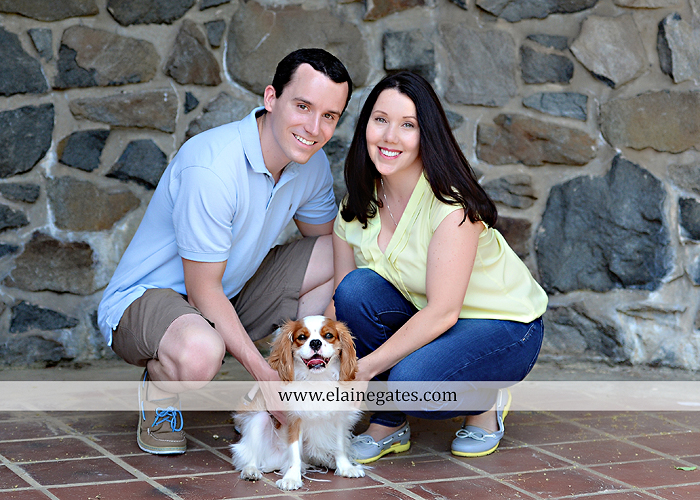 Mechanicsburg Central PA engagement portrait photographer hotel hershey outdoor steps stairs dog grass stone wall pillars hug kiss holding hands fountain water indoor balcony nr 04