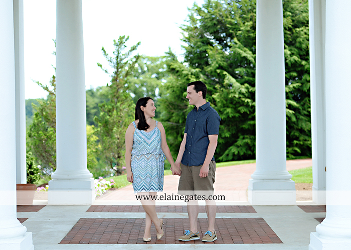 Mechanicsburg Central PA engagement portrait photographer hotel hershey outdoor steps stairs dog grass stone wall pillars hug kiss holding hands fountain water indoor balcony nr 06