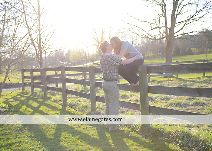 Mechanicsburg Central PA engagement portrait photographer outdoor road fence water steam creek trees sunset motorcycle harley-davidson holding hands kiss cf 02