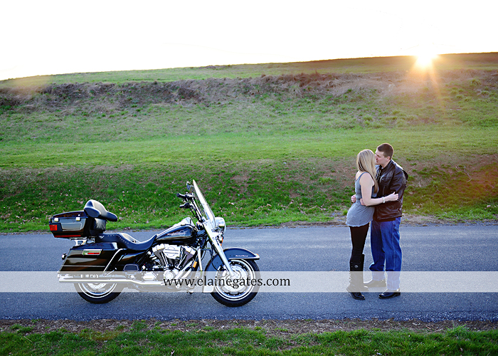 Mechanicsburg Central PA engagement portrait photographer outdoor road fence water steam creek trees sunset motorcycle harley-davidson holding hands kiss cf 09