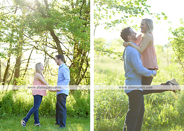 Mechanicsburg Central PA engagement portrait photographer outdoor road field trees water stream creek fence holding hands hug kiss at 9