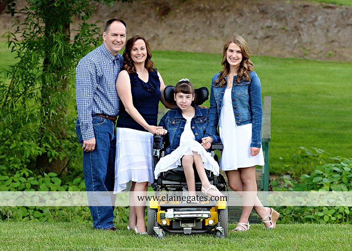 Mechanicsburg Central PA family portrait photographer outdoor children daughters sisters mother father grass trees road wheelchair hug kiss dk 07