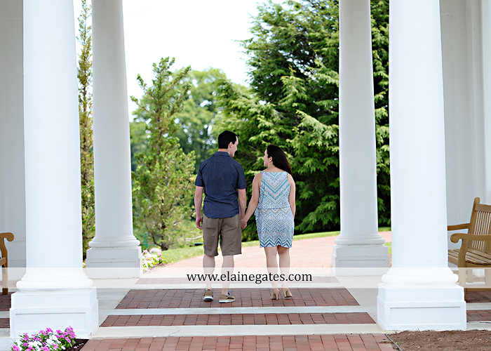 Mechanicsburg Central PA engagement portrait photographer hotel hershey outdoor steps stairs dog grass stone wall pillars hug kiss holding hands fountain water indoor balcony nr 08