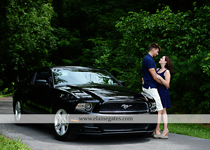 Mechanicsburg Central PA engagement portrait photographer outdoor orchard vineyard trees wildflowers fence field wood wall hug kiss holding hands mustang car aw 11