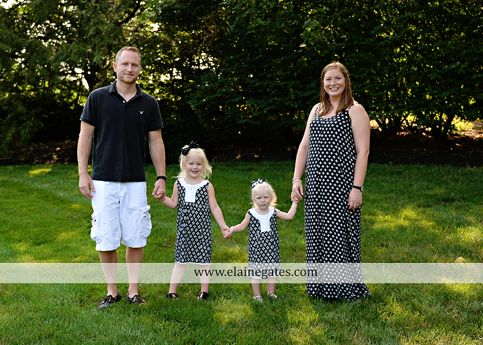 mechanicsburg-central-pa-family-portrait-photographer-outdoor-father-mother-daughters-sisters-siblings-iron-bench-wooden-swing-wildflowers-grass-holding-hands-hug-kw-06