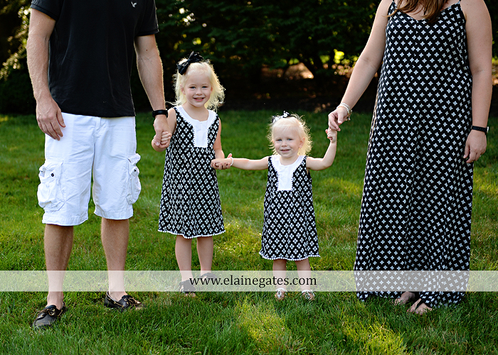 mechanicsburg-central-pa-family-portrait-photographer-outdoor-father-mother-daughters-sisters-siblings-iron-bench-wooden-swing-wildflowers-grass-holding-hands-hug-kw-07