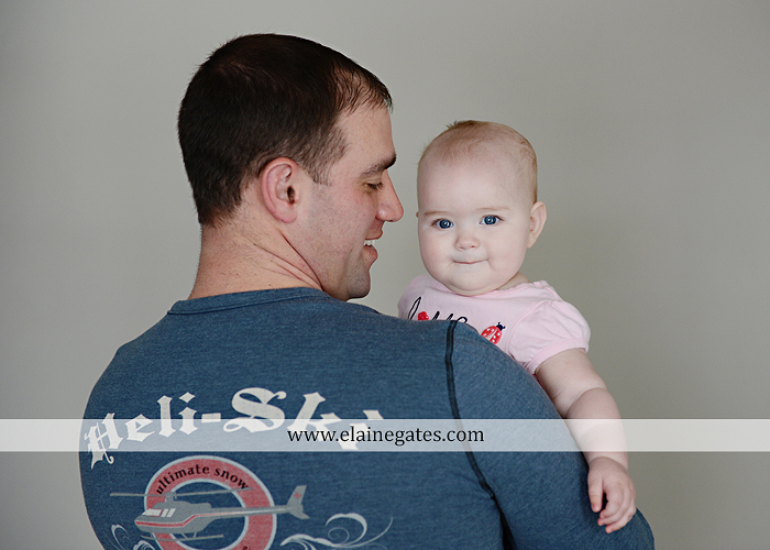 Mechanicsburg Central PA baby child portrait photographer girl indoor hardwood floor rug nursery chair mother father feet toes rb 4