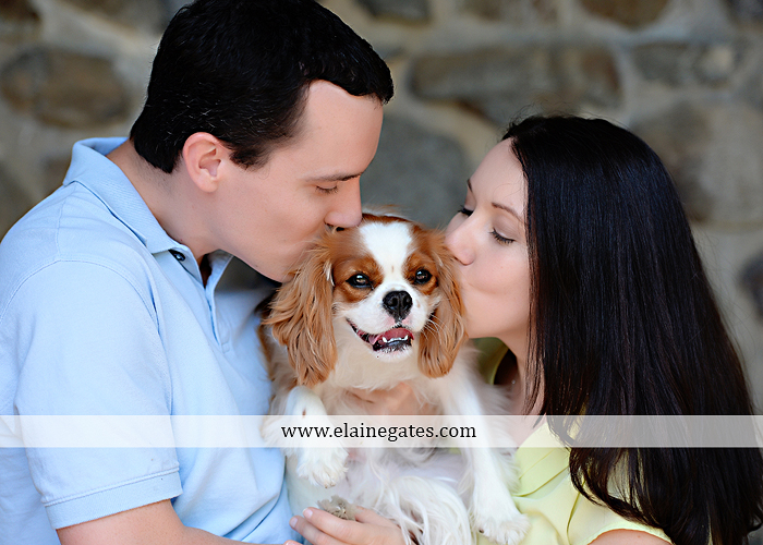 Mechanicsburg Central PA engagement portrait photographer hotel hershey outdoor steps stairs dog grass stone wall pillars hug kiss holding hands fountain water indoor balcony nr 05