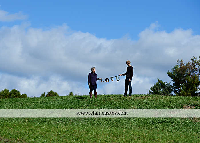 Mechanicsburg Central PA engagement portrait photographer outdoor barn grass trees field truck pumpkin silo path hug kiss ring sm 0