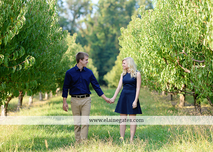 mechanicsburg-central-pa-engagement-portrait-photographer-outdoor-couple-orchard-road-path-trees-holding-hands-kiss-hug-love-barn-field-wildflowers-ls-03