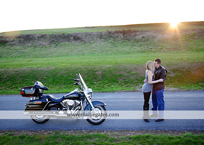 Mechanicsburg Central PA engagement portrait photographer outdoor road fence water steam creek trees sunset motorcycle harley-davidson holding hands kiss cf 09