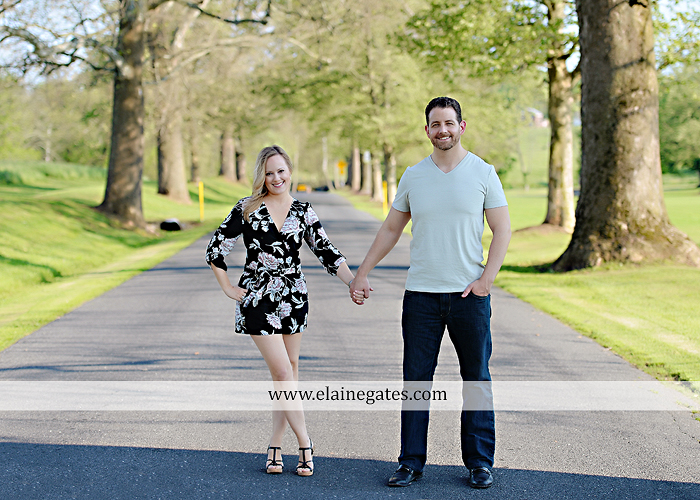 Mechanicsburg Central PA engagement portrait photographer outdoor road field trees water stream creek fence holding hands hug kiss at 1