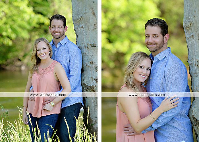 Mechanicsburg Central PA engagement portrait photographer outdoor road field trees water stream creek fence holding hands hug kiss at 6
