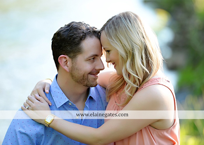 Mechanicsburg Central PA engagement portrait photographer outdoor road field trees water stream creek fence holding hands hug kiss at 8