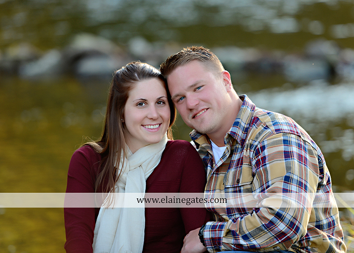 Mechanicsburg Central PA engagement portrait photographer outdoor road trees leaves fence water stream creek ring fishing hook rod hay bale hug kiss kk 04