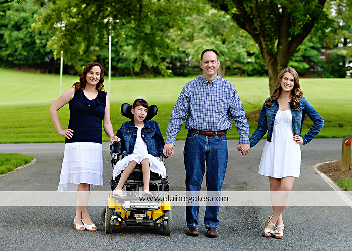 Mechanicsburg Central PA family portrait photographer outdoor children daughters sisters mother father grass trees road wheelchair hug kiss dk 06