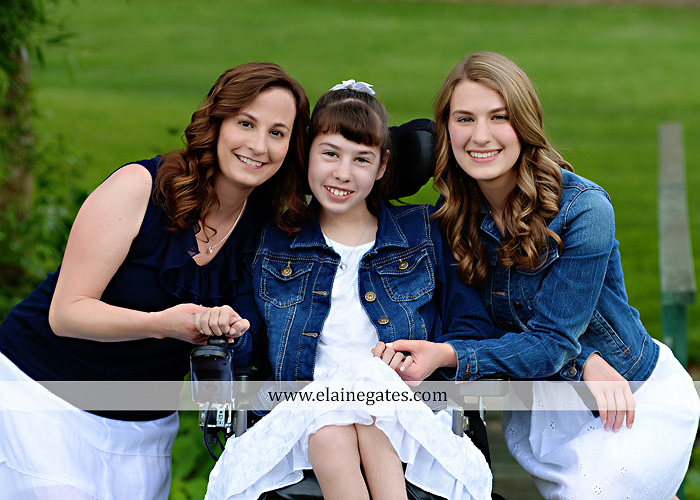 Mechanicsburg Central PA family portrait photographer outdoor children daughters sisters mother father grass trees road wheelchair hug kiss dk 08