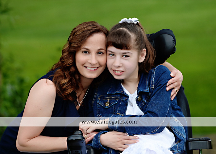 Mechanicsburg Central PA family portrait photographer outdoor children daughters sisters mother father grass trees road wheelchair hug kiss dk 09