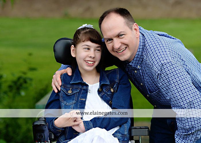 Mechanicsburg Central PA family portrait photographer outdoor children daughters sisters mother father grass trees road wheelchair hug kiss dk 10