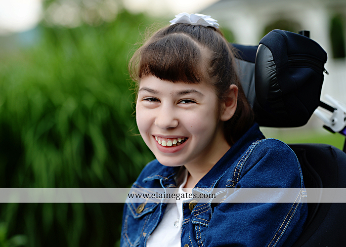 Mechanicsburg Central PA family portrait photographer outdoor children daughters sisters mother father grass trees road wheelchair hug kiss dk 12