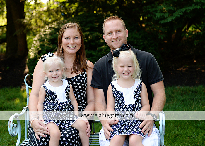 mechanicsburg-central-pa-family-portrait-photographer-outdoor-father-mother-daughters-sisters-siblings-iron-bench-wooden-swing-wildflowers-grass-holding-hands-hug-kw-01