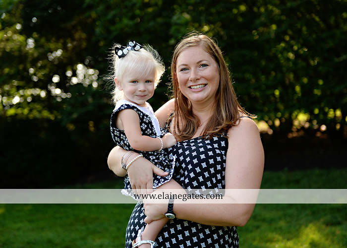 mechanicsburg-central-pa-family-portrait-photographer-outdoor-father-mother-daughters-sisters-siblings-iron-bench-wooden-swing-wildflowers-grass-holding-hands-hug-kw-08