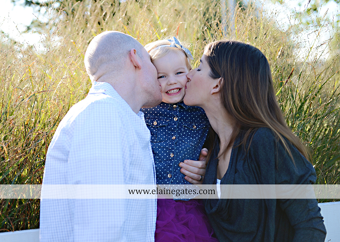 Mechanicsburg Central PA family portrait photographer outdoor girl toddler mother father sidewalk fence grass field kiss rocks az 02