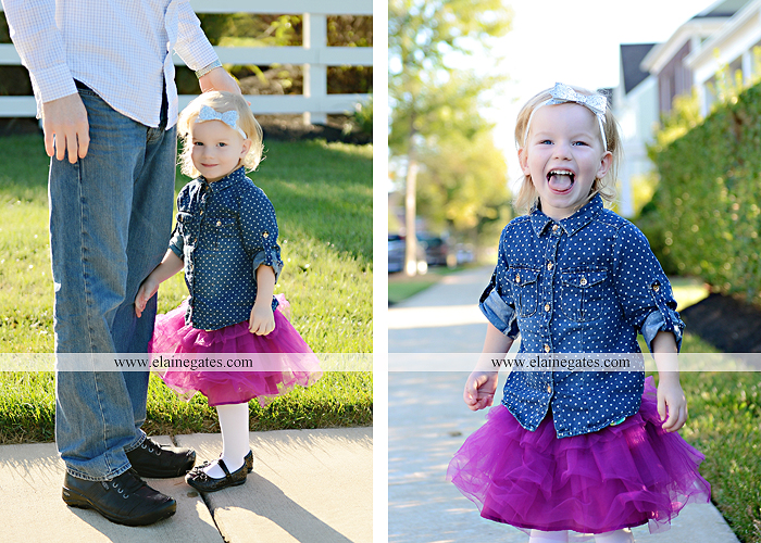 Mechanicsburg Central PA family portrait photographer outdoor girl toddler mother father sidewalk fence grass field kiss rocks az 03