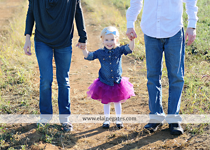 Mechanicsburg Central PA family portrait photographer outdoor girl toddler mother father sidewalk fence grass field kiss rocks az 04