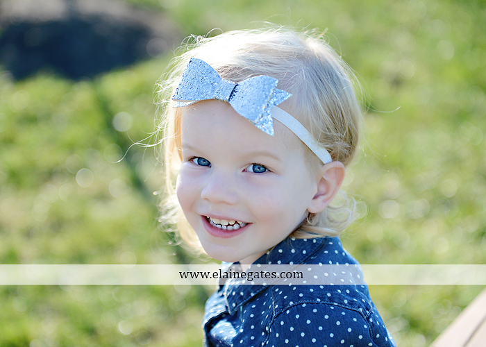 Mechanicsburg Central PA family portrait photographer outdoor girl toddler mother father sidewalk fence grass field kiss rocks az 08