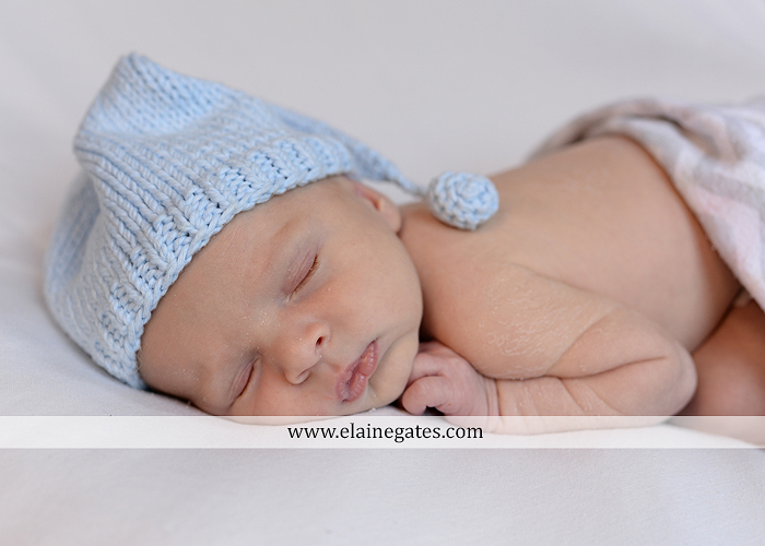 Mechanicsburg Central PA newborn baby portrait photographer boy sleeping blanket knit hat foot hand father dad mom mother kiss mb 02