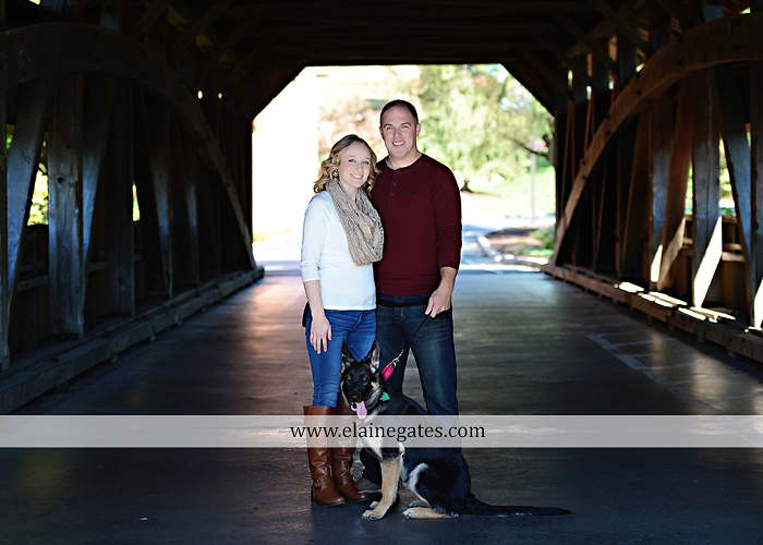 Mechanicsburg Central PA portrait photographer maternity outdoor leaves water stream creek dog pumpkin covered bridge path woods trees kiss expecting mc 3